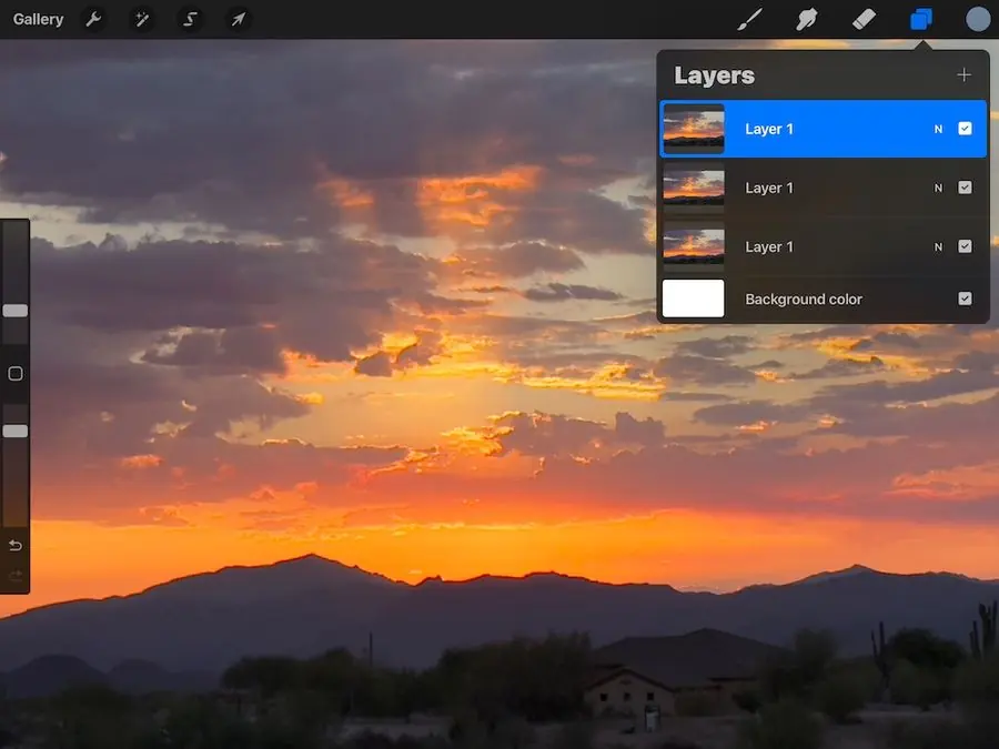 A Procreate screen showing layered versions of a sunset reference